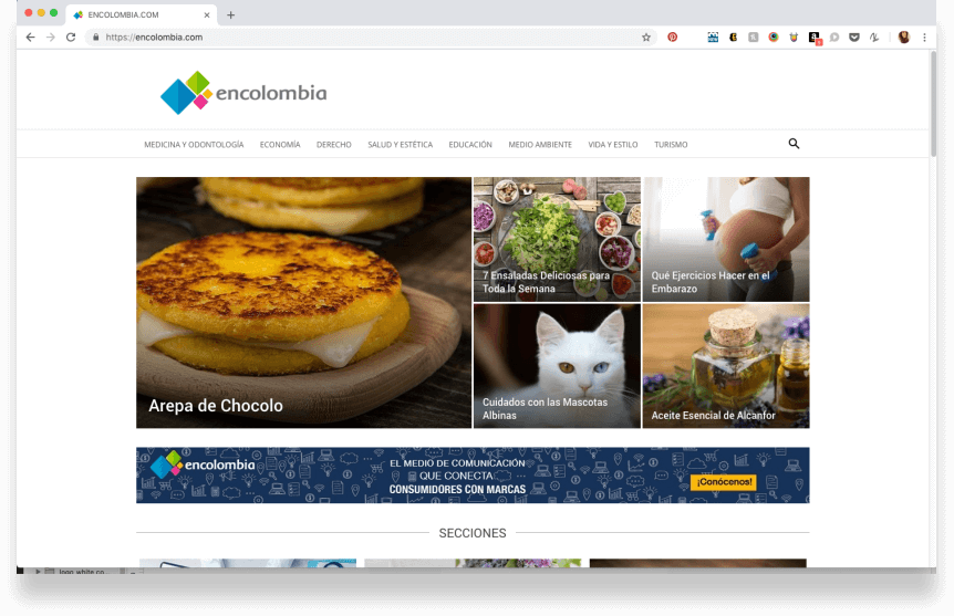 Screenshot of Encolombia.com displayed on a laptop, showcasing a traditional dish and various sections like health and tourism.