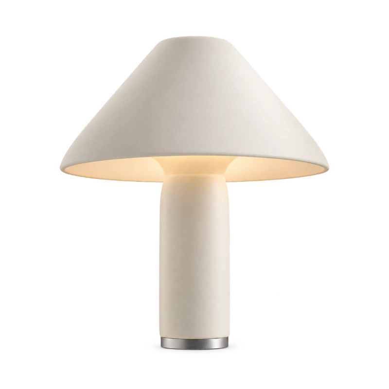 A sculptural porcelain table lamp in the example ad